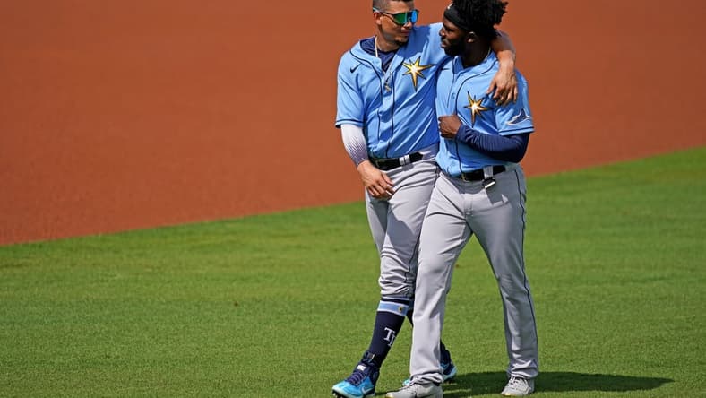 Mar 2, 2021; Fort Myers, Florida, USA; Tampa Bay Rays shortstop Willy Adames (L) and Tampa Bay Rays left fielder Randy Arozarena (R) walk to the dugout prior to the spring training game against the Boston Red Sox at JetBlue Park at Fenway South. Mandatory Credit: Jasen Vinlove-USA TODAY Sports