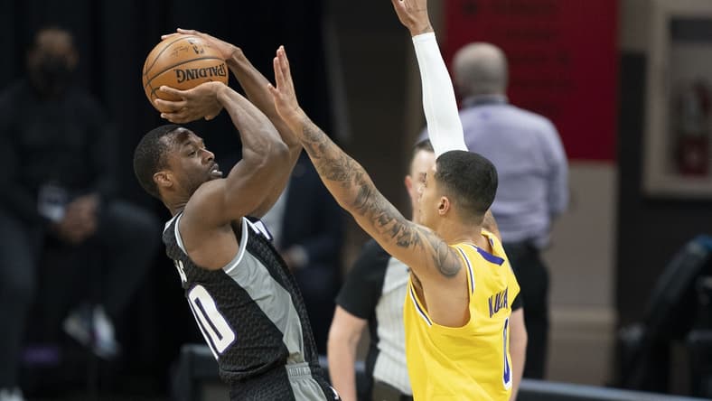 March 3, 2021; Sacramento, California, USA; Sacramento Kings forward Harrison Barnes (40) shoots the basketball against Los Angeles Lakers forward Kyle Kuzma (0)  during the first quarter at Golden 1 Center. Mandatory Credit: Kyle Terada-USA TODAY Sports