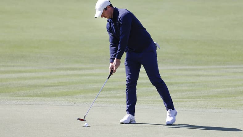Mar 4, 2021; Orlando, Florida, USA; Rory McIlroy taps in his putt on the 18th green during the first round of the Arnold Palmer Invitational golf tournament at Bay Hill Club & Lodge. Mandatory Credit: Reinhold Matay-USA TODAY Sports