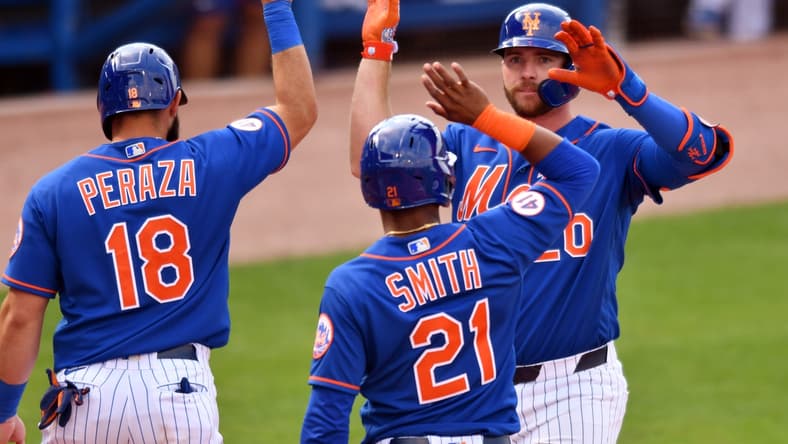 Mar 4, 2021; Port St. Lucie, Florida, USA; New York Mets first baseman Pete Alonso (20) is congratulated by Mallex Smith (21) and Jose Peraza (18) after hitting a grand slam home run against the Washington Nationals in the fifth inning of a spring training game at Clover Park. Mandatory Credit: Jim Rassol-USA TODAY Sports
