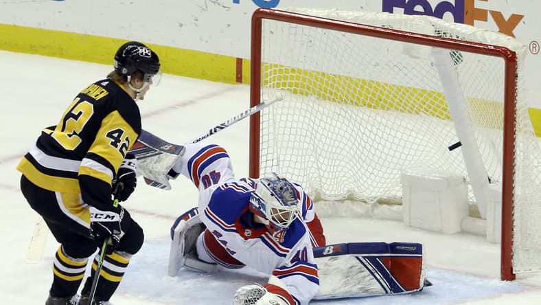 Mar 7, 2021; Pittsburgh, Pennsylvania, USA;  Pittsburgh Penguins right wing Kasperi Kapanen (42) scores a goal against New York Rangers goaltender Alexandar Georgiev (40) during the first period at PPG Paints Arena. Mandatory Credit: Charles LeClaire-USA TODAY Sports