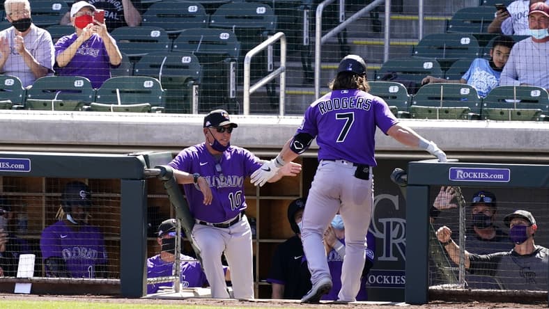 Mar 9, 2021; Scottsdale, Arizona, USA; Colorado Rockies manager Bud Black reacts after Brendan Rodgers (7) scored on a Dom Nu ez RBI-single against the Arizona Diamondbacks in the fourth inning during a spring training game at Salt River Fields at Talking Stick. Mandatory Credit: Rob Schumacher-Arizona Republic