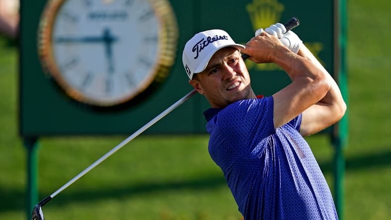 Mar 14, 2021; Ponte Vedra Beach, Florida, USA; Justin Thomas plays his shot from the 18th tee during the final round of The Players Championship golf tournament at TPC Sawgrass - Stadium Course. Mandatory Credit: Jasen Vinlove-USA TODAY Sports