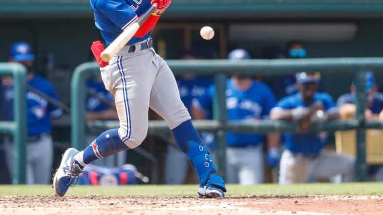 Mar 15, 2021; Lakeland, Florida, USA;  Toronto Blue Jays shortstop Santiago Espinal (5) singles in the 6th inning during spring training at Publix Field at Joker Marchant Stadium. Mandatory Credit: Nathan Ray Seebeck-USA TODAY Sports