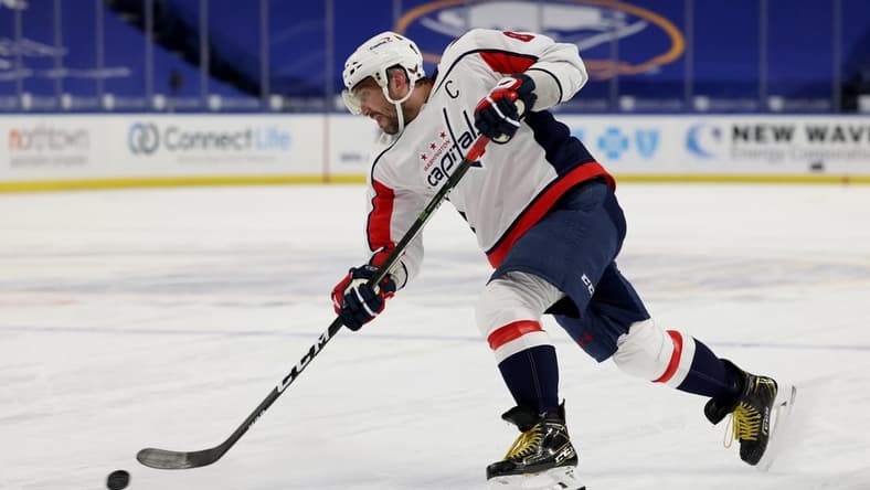 Mar 15, 2021; Buffalo, New York, USA; Washington Capitals left wing Alex Ovechkin (8) takes a shot on goal during the first period against the Buffalo Sabres at KeyBank Center. Mandatory Credit: Timothy T. Ludwig-USA TODAY Sports