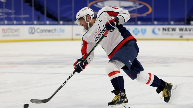 Mar 15, 2021; Buffalo, New York, USA; Washington Capitals left wing Alex Ovechkin (8) takes a shot on goal during the first period against the Buffalo Sabres at KeyBank Center. Mandatory Credit: Timothy T. Ludwig-USA TODAY Sports