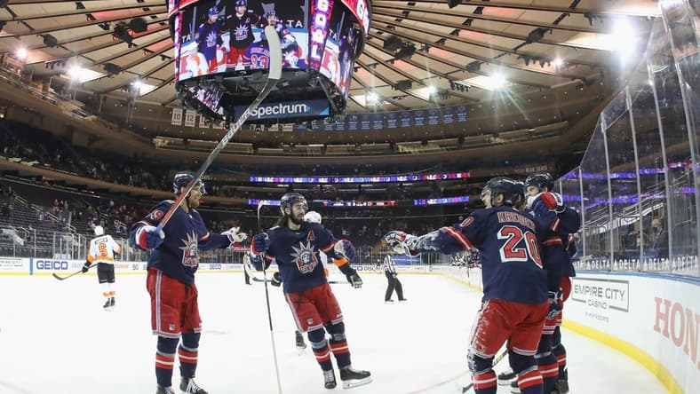 Mar 17, 2021; New York, New York, USA; The New York Rangers celebrate after a goal by right wing Pavel Buchnevich (89) against the Philadelphia Flyers at 1:38 of the second period at Madison Square Garden. Mandatory Credit: Bruce Bennett/POOL PHOTOS-USA TODAY Sports