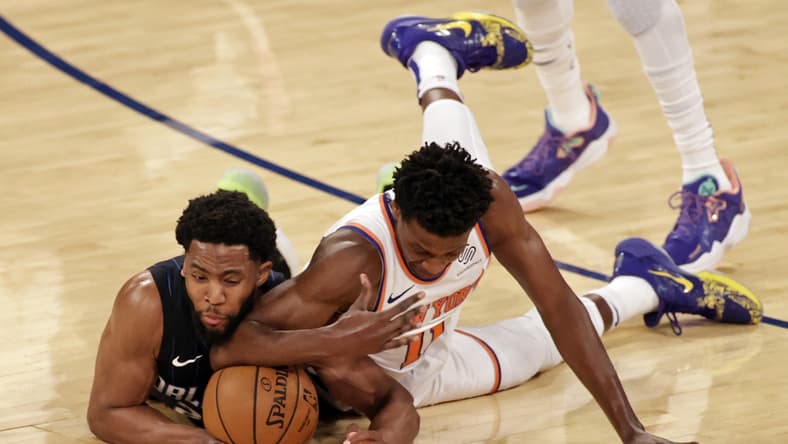 Mar 18, 2021; New York, New York, USA;    Orlando Magic guard Chasson Randle and New York Knicks guard Frank Ntilikina dive for a loose ball during the first half of an NBA basketball game Thursday, March 18, 2021, in New York. Mandatory Credit: Adam Hunger/Pool Photo-USA TODAY Sports