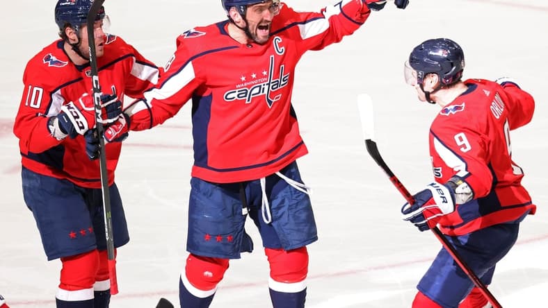 Mar 19, 2021; Washington, District of Columbia, USA;Washington Capitals left wing Alex Ovechkin (8) celebrates with Capitals defenseman Dmitry Orlov (9) and Capitals right wing Daniel Sprong (10) after scoring the go ahead goal against the New York Rangers in the third period at Capital One Arena. Mandatory Credit: Geoff Burke-USA TODAY Sports