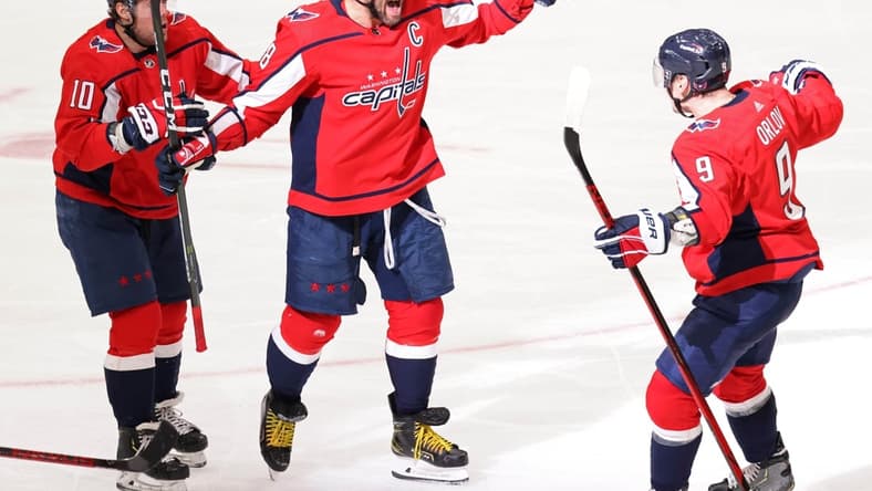 Mar 19, 2021; Washington, District of Columbia, USA;Washington Capitals left wing Alex Ovechkin (8) celebrates with Capitals defenseman Dmitry Orlov (9) and Capitals right wing Daniel Sprong (10) after scoring the go ahead goal against the New York Rangers in the third period at Capital One Arena. Mandatory Credit: Geoff Burke-USA TODAY Sports