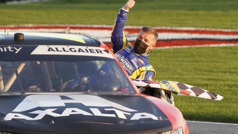 Mar 20, 2021; Hampton, GA, USA; NASCAR Xfinity Series driver Justin Allgaier (7) gives the crowd a thumbs up after winning at Atlanta Motor Speedway. Mandatory Credit: Marvin Gentry-USA TODAY Sports