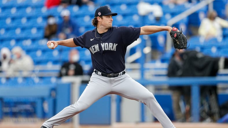 Mar 21, 2021; Dunedin, Florida, USA;  New York Yankees starting pitcher Gerrit Cole (45) pitches in the first inning against the Toronto Blue Jays during spring training at TD Ballpark. Mandatory Credit: Nathan Ray Seebeck-USA TODAY Sports