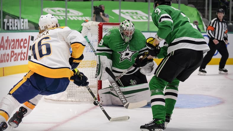 Mar 21, 2021; Dallas, Texas, USA; Dallas Stars goaltender Anton Khudobin (35) stops a shot by Nashville Predators center Rem Pitlick (16) during the first period at the American Airlines Center. Mandatory Credit: Jerome Miron-USA TODAY Sports