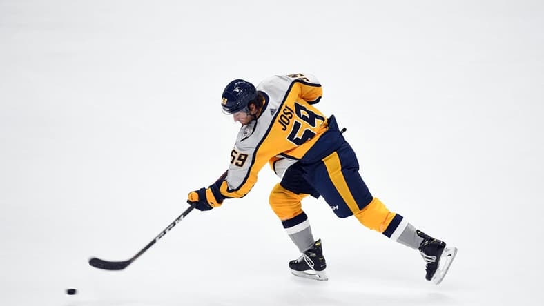 Mar 23, 2021; Nashville, Tennessee, USA; Nashville Predators defenseman Roman Josi (59) shoots the puck during warmups before the game against the Detroit Red Wings at Bridgestone Arena. Mandatory Credit: Christopher Hanewinckel-USA TODAY Sports