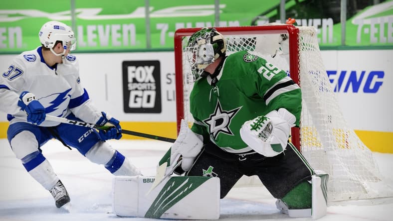 Mar 25, 2021; Dallas, Texas, USA; Dallas Stars goaltender Jake Oettinger (29) turns away a shot by Tampa Bay Lightning center Yanni Gourde (37) during the first period at the American Airlines Center. Mandatory Credit: Jerome Miron-USA TODAY Sports