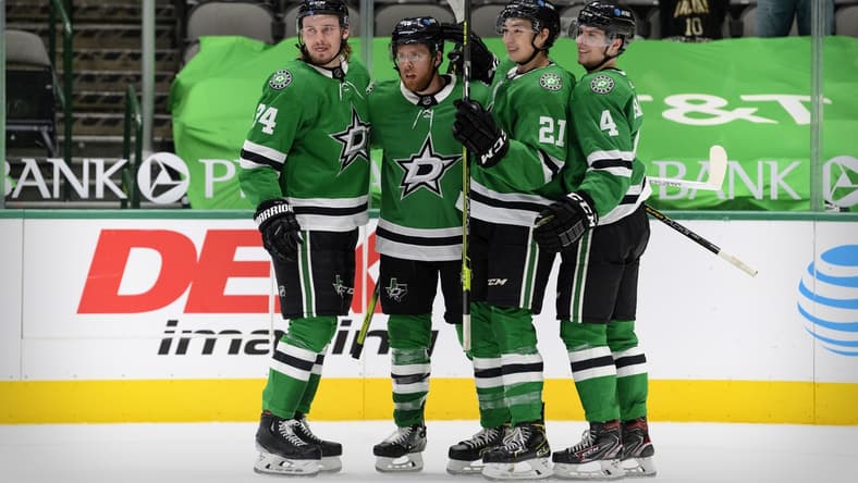 Mar 25, 2021; Dallas, Texas, USA; Dallas Stars left wing Roope Hintz (24) and center Joe Pavelski (16) and left wing Jason Robertson (21) and defenseman Miro Heiskanen (4) celebrates a goal scored by Pavelski against the Tampa Bay Lightning during the second period at the American Airlines Center. Mandatory Credit: Jerome Miron-USA TODAY Sports