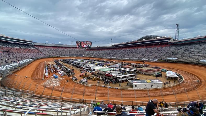 Mar 27, 2021; Bristol, TN, USA; General view of NASCAR Gander RV and Outdoors Truck Series trucks after one lap of qualifying for the Pinty's Truck Race on Dirt at Bristol Motor Speedway. Mandatory Credit: Randy Sartin-USA TODAY Sports