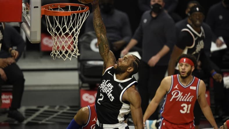 Mar 27, 2021; Los Angeles, California, USA; LA Clippers forward Kawhi Leonard (2) dunks the ball during the first half against the Philadelphia 76ers at Staples Center. Mandatory Credit: Kelvin Kuo-USA TODAY Sports