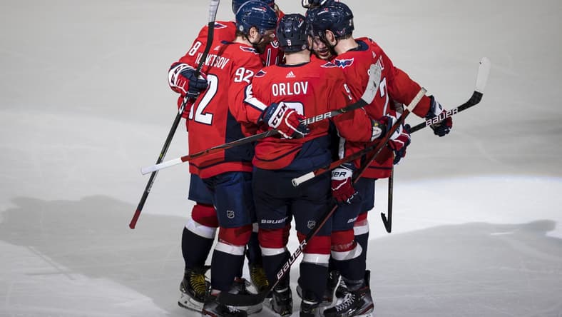 Mar 28, 2021; Washington, District of Columbia, USA; Washington Capitals right wing T.J. Oshie (77) celebrates with center Evgeny Kuznetsov (92) defenseman Dmitry Orlov (9) left wing Alex Ovechkin (8) and defenseman Justin Schultz (2) after scoring a goal against the New York Rangers during the third period at Capital One Arena. Mandatory Credit: Scott Taetsch-USA TODAY Sports