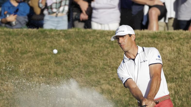 Mar 28, 2021; Austin, Texas, USA; Billy Horschel hits out of the bunker on the 16th hole during the final round of the WGC Dell Technologies Match Play golf tournament at Austin Country Club over Scottie Scheffler. Mandatory Credit: Erich Schlegel-USA TODAY Sports