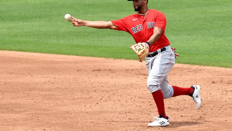 Mar 29, 2021; North Port, Florida, USA; Boston Red Sox infielder Xander Bogaerts (2) throws to first base in the third inning against the Atlanta Braves  during spring training at CoolToday Park. Mandatory Credit: Jonathan Dyer-USA TODAY Sports