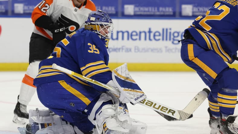 Mar 29, 2021; Buffalo, New York, USA;  Buffalo Sabres goaltender Linus Ullmark (35) looks for the puck after making a save against the Philadelphia Flyers during the first period at KeyBank Center. Mandatory Credit: Timothy T. Ludwig-USA TODAY Sports