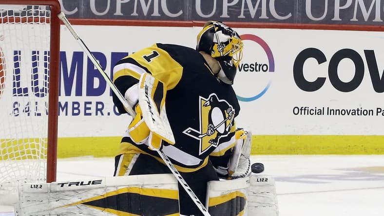 Mar 29, 2021; Pittsburgh, Pennsylvania, USA;  Pittsburgh Penguins goaltender Casey DeSmith (1) makes a save against the New York Islanders during the third period at PPG Paints Arena. Pittsburgh won 2-1 Mandatory Credit: Charles LeClaire-USA TODAY Sports