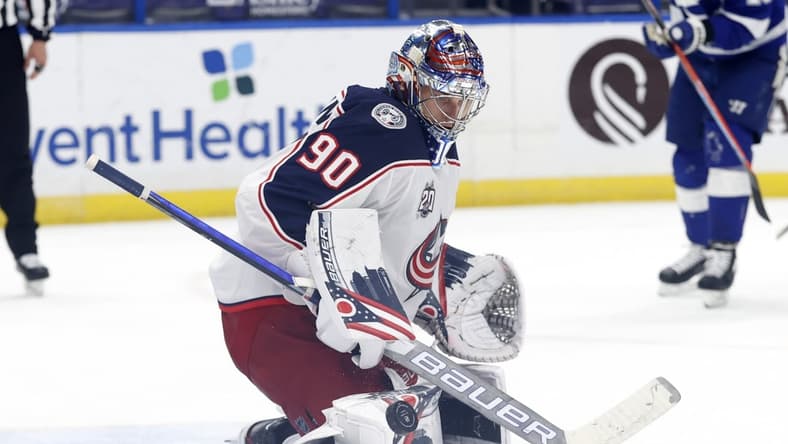 Mar 30, 2021; Tampa, Florida, USA ; Columbus Blue Jackets goaltender Elvis Merzlikins (90) makes a save against the Tampa Bay Lightning during the third period at Amalie Arena. Mandatory Credit: Kim Klement-USA TODAY Sports
