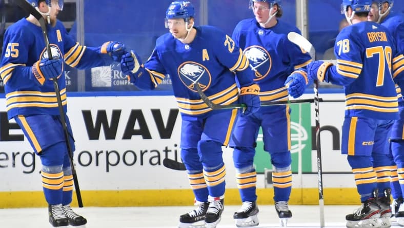 Mar 31, 2021; Buffalo, New York, USA; Buffalo Sabres defenseman Rasmus Ristolainen (55) congratulates center Sam Reinhart (23) after scoring a goal during the first period against the Philadelphia Flyers at KeyBank Center. Mandatory Credit: Mark Konezny-USA TODAY Sports