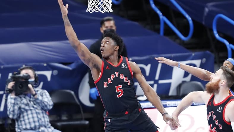Mar 31, 2021; Oklahoma City, Oklahoma, USA; Toronto Raptors forward Stanley Johnson (5) goes to the basket against the Oklahoma City Thunder during the first half at Chesapeake Energy Arena. Mandatory Credit: Alonzo Adams-USA TODAY Sports