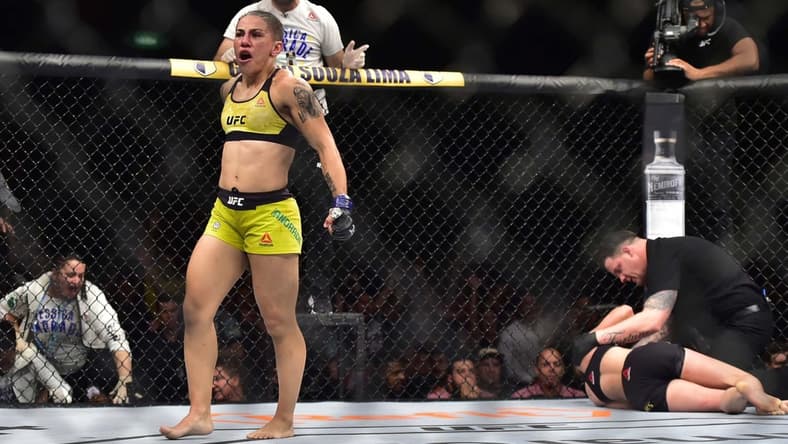 May 11, 2019; Rio de Janeiro, Brazil; Jessica Andrade (blue gloves) reacts to fight against Rose Namajunas (red gloves) during UFC 237 at Jeunesse Arena. Mandatory Credit: Jason Silva-USA TODAY Sports