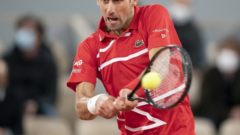 Oct 11, 2020;  Paris, France; Novak Djokovic (SRB) in action during his match against Rafael Nadal (ESP) on day 15 at Stade Roland Garros. Mandatory Credit: Susan Mullane-USA TODAY Sports