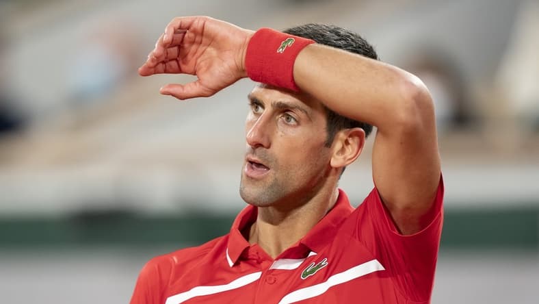 Oct 11, 2020;  Paris, France; Novak Djokovic (SRB) reacts during his match against Rafael Nadal (ESP) on day 15 at Stade Roland Garros. Mandatory Credit: Susan Mullane-USA TODAY Sports