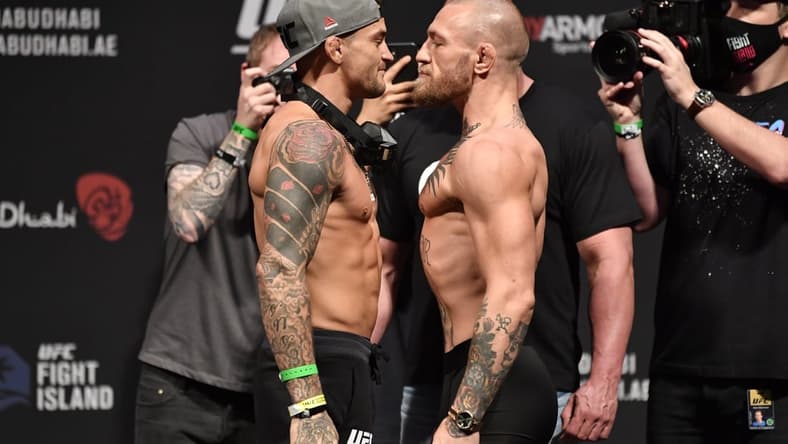 Jan 22, 2021; Abu Dhabi, UNITED ARAB EMIRATES;   Dustin Poirier and Conor McGregor of Ireland face off during the UFC 257 weigh-in at Etihad Arena on UFC Fight Island on January 22, 2021 in Abu Dhabi, United Arab Emirates. Mandatory Credit: Jeff Bottari/Handout Photo via USA TODAY Sports