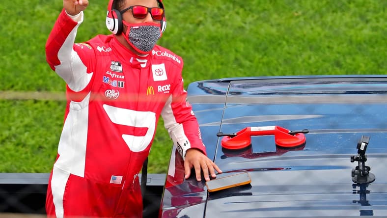 Feb 14, 2021; Daytona Beach, Florida, USA; NASCAR Cup Series driver Bubba Wallace (23) waves to fans during driver introductions before the Daytona 500 at Daytona International Speedway. Mandatory Credit: Mark J. Rebilas-USA TODAY Sports