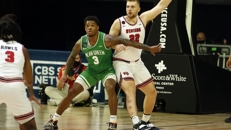 Mar 13, 2021; Frisco, TX, USA; North Texas Mean Green guard Javion Hamlet (3) guards Western Kentucky Hilltoppers forward Carson Williams (22) during the first half at Ford Center at The Star. Mandatory Credit: Tim Heitman-USA TODAY Sports