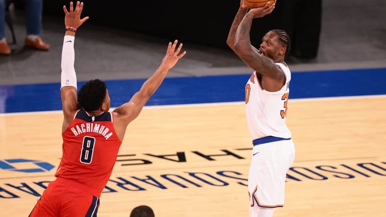 Mar 23, 2021; New York, New York, USA; New York Knicks forward Julius Randle (30) shoots the ball over Washington Wizards forward Rui Hachimura (8) during the second half at Madison Square Garden. Mandatory Credit: Vincent Carchietta-USA TODAY Sports