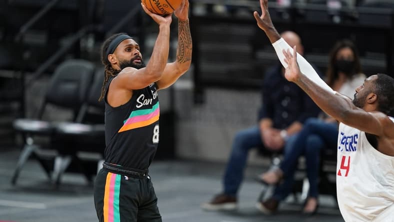 Mar 25, 2021; San Antonio, Texas, USA; San Antonio Spurs guard Patty Mills (8) shoots in the first half against the Los Angeles Clippers at the AT&T Center. Mandatory Credit: Daniel Dunn-USA TODAY Sports