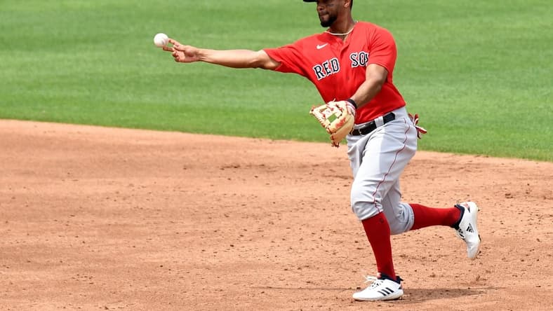 Mar 29, 2021; North Port, Florida, USA; Boston Red Sox infielder Xander Bogaerts (2) throws to first base in the third inning against the Atlanta Braves  during spring training at CoolToday Park. Mandatory Credit: Jonathan Dyer-USA TODAY Sports