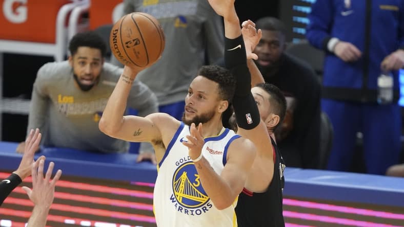 March 29, 2021; San Francisco, California, USA; Golden State Warriors guard Stephen Curry (30) shoots the basketball against Chicago Bulls center Nikola Vucevic (9) during the third quarter at Chase Center. Mandatory Credit: Kyle Terada-USA TODAY Sports