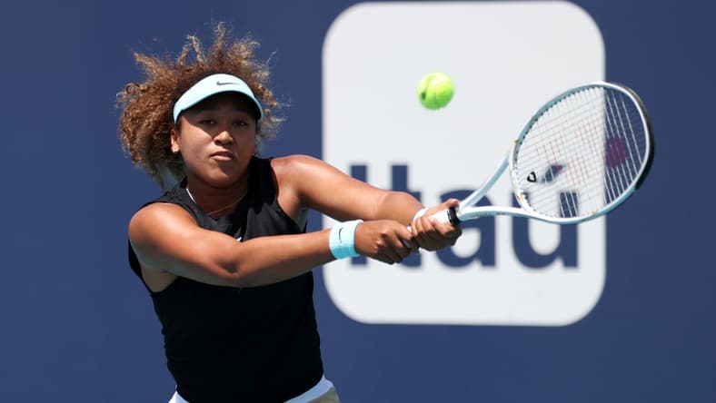 Mar 31, 2021; Miami, Florida, USA; Naomi Osaka of Japan hits a backhand against Maria Sakkari of Greece (not pictured) in a women's singles quarterfinal in the Miami Open at Hard Rock Stadium. Mandatory Credit: Geoff Burke-USA TODAY Sports