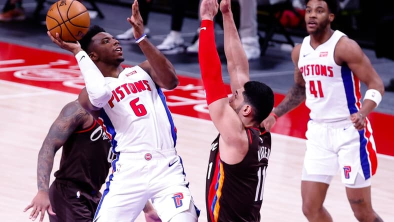 Mar 31, 2021; Detroit, Michigan, USA;  Detroit Pistons guard Hamidou Diallo (6) shoots on Portland Trail Blazers center Enes Kanter (11) in the first half at Little Caesars Arena. Mandatory Credit: Rick Osentoski-USA TODAY Sports