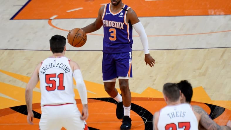 Mar 31, 2021; Phoenix, Arizona, USA; Phoenix Suns guard Chris Paul (3) dribbles the ball against the Chicago Bulls during the first half at Phoenix Suns Arena. Mandatory Credit: Joe Camporeale-USA TODAY Sports