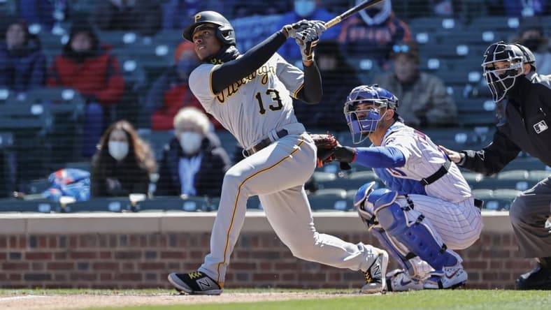 Apr 1, 2021; Chicago, Illinois, USA; Pittsburgh Pirates third baseman Ke'Bryan Hayes (13) hits a two-run home run against the Chicago Cubs in the first inning at Wrigley Field. Mandatory Credit: Kamil Krzaczynski-USA TODAY Sports