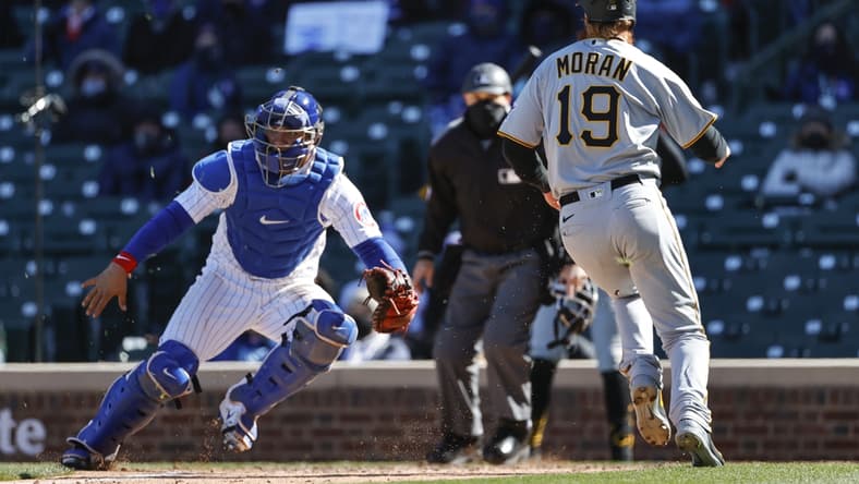 Apr 1, 2021; Chicago, Illinois, USA; Pittsburgh Pirates third baseman Colin Moran (19) scores against the Chicago Cubs in the fifth inning at Wrigley Field. Mandatory Credit: Kamil Krzaczynski-USA TODAY Sports