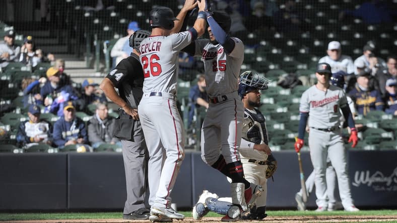Apr 1, 2021; Milwaukee, Wisconsin, USA; Minnesota Twins center fielder Byron Buxton (25) is congratulated by teammate Max Kepler (26) after hitting a home run in the seventh inning against the Milwaukee Brewers at American Family Field. Mandatory Credit: Michael McLoone-USA TODAY Sports