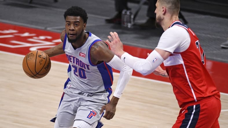 Apr 1, 2021; Detroit, Michigan, USA; Detroit Pistons guard Josh Jackson (20) drives to the basket as Washington Wizards center Alex Len (27) defends during the first quarter at Little Caesars Arena. Mandatory Credit: Tim Fuller-USA TODAY Sports