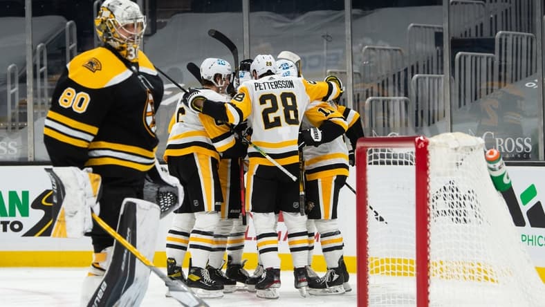 Apr 1, 2021; Boston, Massachusetts, USA; Pittsburgh Penguins defenseman Marcus Pettrsson (28) celebrates with teammates after Zach Aston-Reese (12) scored a goal against the Boston Bruins in the second period at TD Garden. Mandatory Credit: Kathryn Riley-USA TODAY Sports