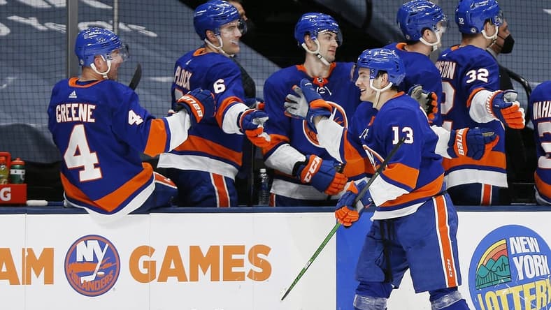 Apr 1, 2021; Uniondale, New York, USA; New York Islanders center Mathew Barzal (13) is congratulated after scoring his third goal of the game for a hat trick against the Washington Capitals during the third period at Nassau Veterans Memorial Coliseum. Mandatory Credit: Andy Marlin-USA TODAY Sports