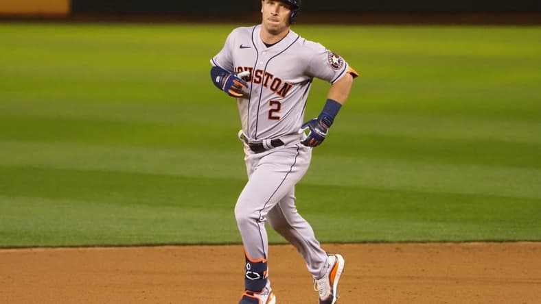 Apr 1, 2021; Oakland, California, USA; Houston Astros third baseman Alex Bregman (2) rounds the bases on a solo home run against the Oakland Athletics during the eighth inning at RingCentral Coliseum. Mandatory Credit: Kelley L Cox-USA TODAY Sports